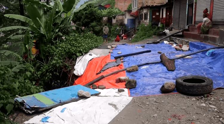 Floods cut off communities in Nepal as heavy rains damage roads